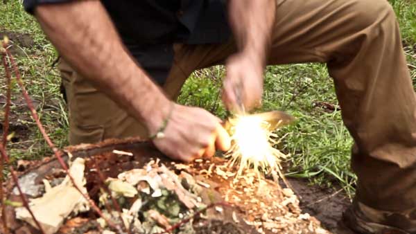 Jeff Zausch demonstrating the Skeletek Bushcraft ferro rod striking method