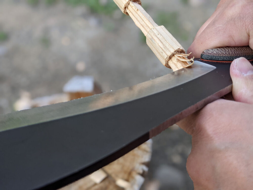 Jaime de la Parra working the SLYSTEEL Survival Kukri knife at the hilt for try stick diameter reduction. Photograph by Brandon Barlow.